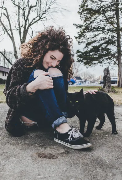 woman petting cat